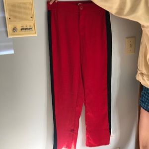 red pants with buttons along the side.